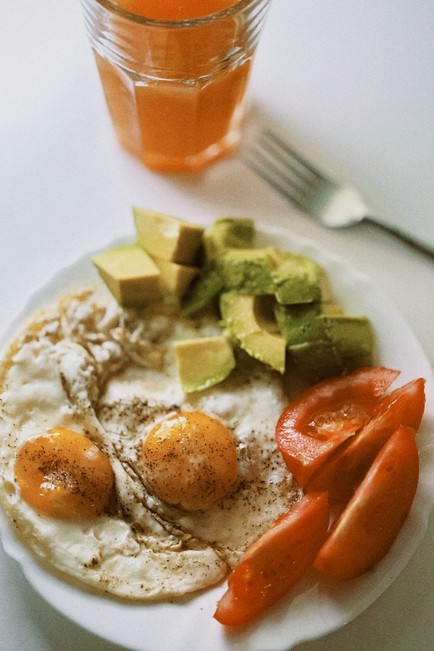 delicious breakfast with fried eggs and vegetables
