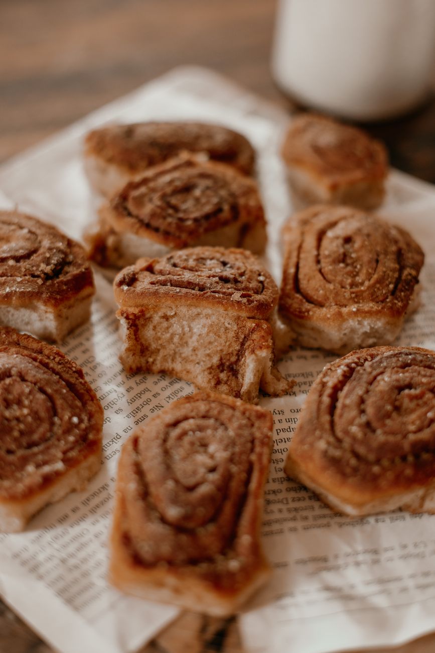 freshly baked cinnamon rolls on paper