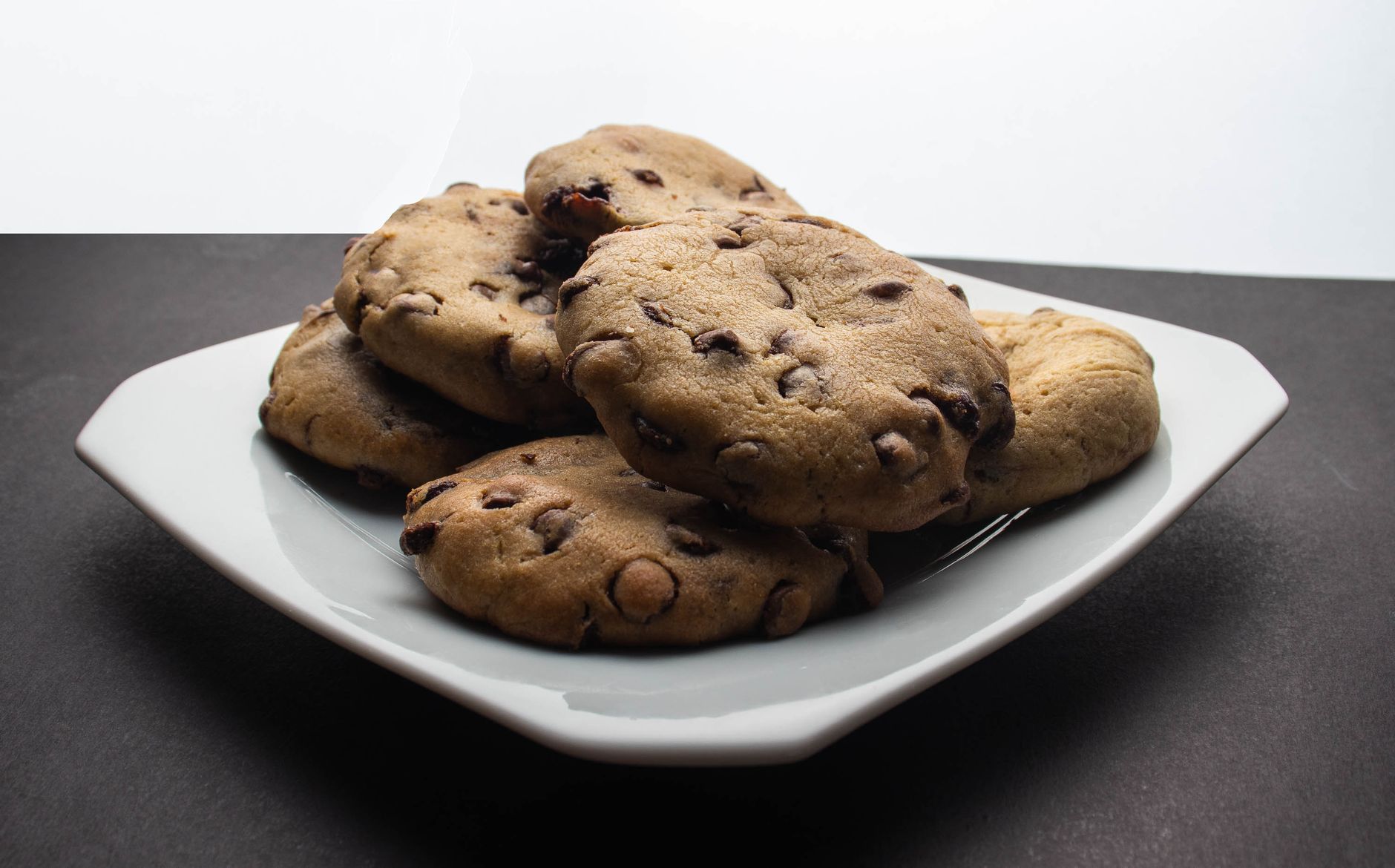 a plate of chocolate chip cookies